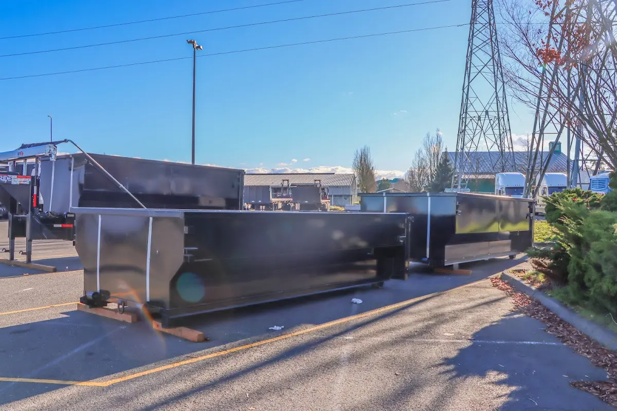 Roll-off dumpster ready for waste disposal at job site for 2 Yard Dumpster Rental in Sun Prairie